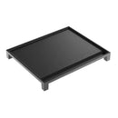 Black flat cast iron griddle with raised rim and corner feet