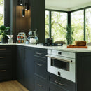 Forno Capoliveri Espresso 30-Inch 1.2 Cu.ft  Microwave Drawer in White with Antique Brass Trim shown in a styled kitchen