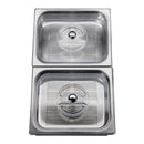 Stainless steel steam cooker basins with perforated bottoms and circular vent lids