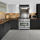 Stainless wall mount range hood over cooktop with baffle filters