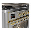 ILVE Majestic III 60-inch Dual Fuel Range with 7 Natural Gas Burner, Griddle, French Top and Triple Glass Door Electric Oven in Stainless Steel with Brass Trim (UM60FSNR3SSG)