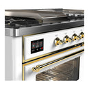 ILVE Majestic III 60-inch Dual Fuel Range with 7 Natural Gas Burner, Griddle, French Top and Triple Glass Door Electric Oven in White with Brass Trim (UM60FSNR3WHG)
