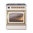 Antique white dual fuel range with brass controls and brass-trimmed triple glass oven door
