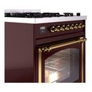 Burgundy ILVE range side view with brass control knobs and open oven door
