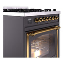 Matte graphite range control panel with brass knobs and brass-trimmed oven door frame.