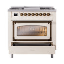 Antique white gas range with bronze knobs, glass oven door window, warming drawer open