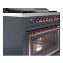 Blue-grey ILVE range front with copper-trimmed oven door and row of control knobs