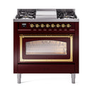 Burgundy gas range with brass trim, triple glass oven door and brass control knobs.