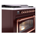 Burgundy ILVE dual-fuel gas range with copper oven handle and control knobs
