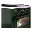 Emerald green range door with bronze handle and lit oven window