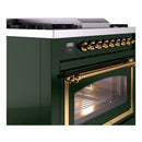 Emerald green dual-fuel range front with brass control knobs and oven window