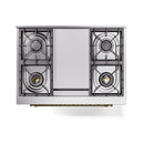 Top view of stainless steel cooktop with four burner grates