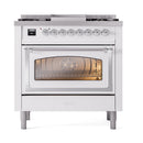 White dual-fuel range with open triple-pane oven door and front control knobs