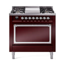 Burgundy dual-fuel oven range with solid door, chrome handle, and control knobs