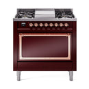 Burgundy dual fuel range with copper-trim control knobs and oven door