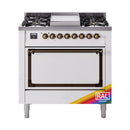 Dual fuel gas range with open oven door and control knobs, bronze accents