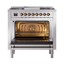 Stainless steel dual fuel range with bronze-trimmed control knobs and digital display