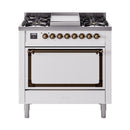 White dual-fuel range with bronze knobs, cooktop burners, and solid oven door