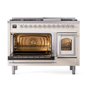 Antique white dual-fuel range with open oven doors and control knobs across the back panel