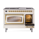 Freestanding dual fuel range with brass trim; right oven door open, left oven glass door.