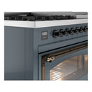 Blue grey dual fuel range side view with control panel, knobs, and bronze oven handle