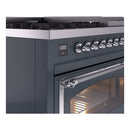 Close-up of blue grey dual fuel range control panel with knob row and oven handle
