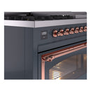Close-up of blue gray dual-fuel range control panel with copper knobs and display