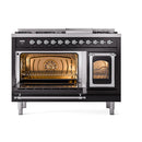 Glossy black dual fuel range with left oven lit and right oven open with rack shelves