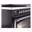 Glossy black dual fuel range control panel with chrome knobs and digital display