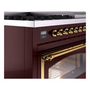 Burgundy dual fuel range close-up of brass control knobs and digital display