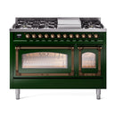 Emerald green dual-fuel range with bronze knobs, burners, and lit ovens