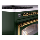 Emerald green range control panel with brass knobs and illuminated oven handle and door