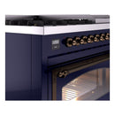 Midnight blue range side panel with bronze control rail and oven door