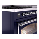 Midnight blue control panel and chrome oven handle on freestanding dual fuel range