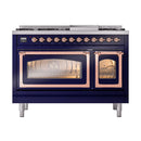Freestanding dual fuel range in midnight blue with copper-trimmed oven doors and control knobs.