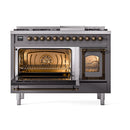 Matte graphite dual fuel range with both ovens open and bronze handles, interiors lit