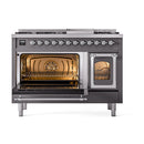 Matte graphite dual fuel range with left oven open and lit bake cavity behind glass