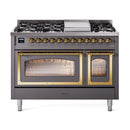 Matte graphite dual fuel range with burners and open ovens, brass trim and lit interior