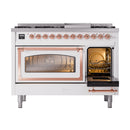 Freestanding dual fuel gas range with left oven door open and right oven door closed
