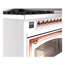 Freestanding dual fuel range control knobs and copper handle with lit oven interior
