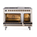Antique white dual oven range with both oven doors open showing interior racks