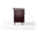 Burgundy solid oven door on freestanding range with side knobs and metal legs