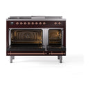 Burgundy dual-fuel range with both ovens open, copper-trim frames, and racks