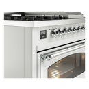 Dual fuel range side view with chrome oven handle, illuminated oven interior, and control panel
