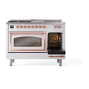 Dual-fuel range with left oven door open, showing interior fan and racks
