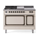 Antique white dual fuel range with bronze-trim oven doors and cooktop control knobs exposed
