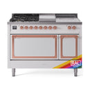 Dual fuel range front view with copper-trimmed oven doors and griddle top