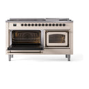 Antique white dual fuel range with oven interiors visible and bronze door handles