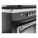 Chrome control knobs and glossy black oven handle on a dual fuel gas range