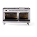 White dual fuel gas range with both oven doors open, showing illuminated interiors